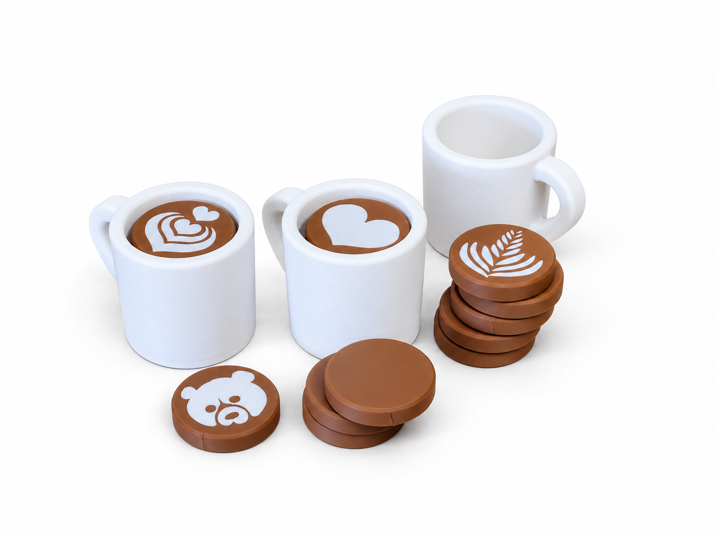 White 3D-printed pretend-play coffee cups with removable brown latte-art inserts